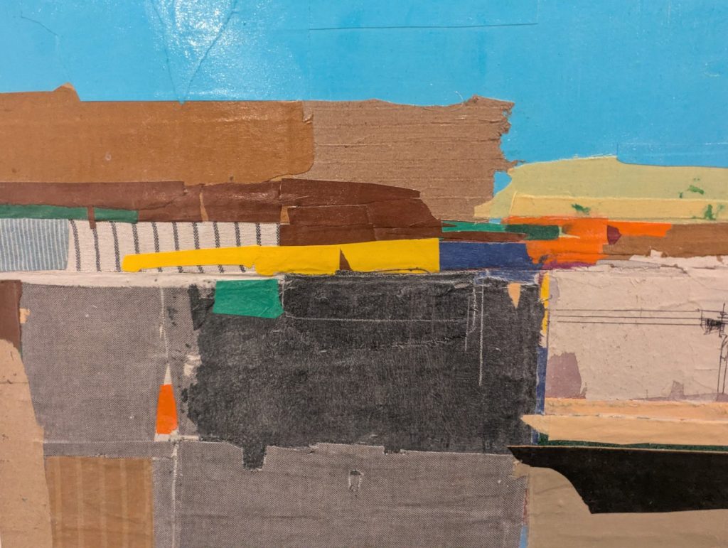 Abstract mixed-media artwork composed of layered papers, tape, fabric and painted surfaces. Horizontal bands of blue, brown, yellow, black and grey overlap to create a fragmented landscape-like composition with visible textures, torn edges and collaged materials.